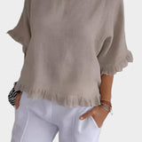 Top leggero in lino con volant e arricciature