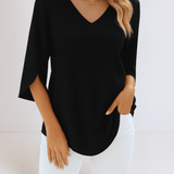 Top elegante con scollo a V e maniche aperte